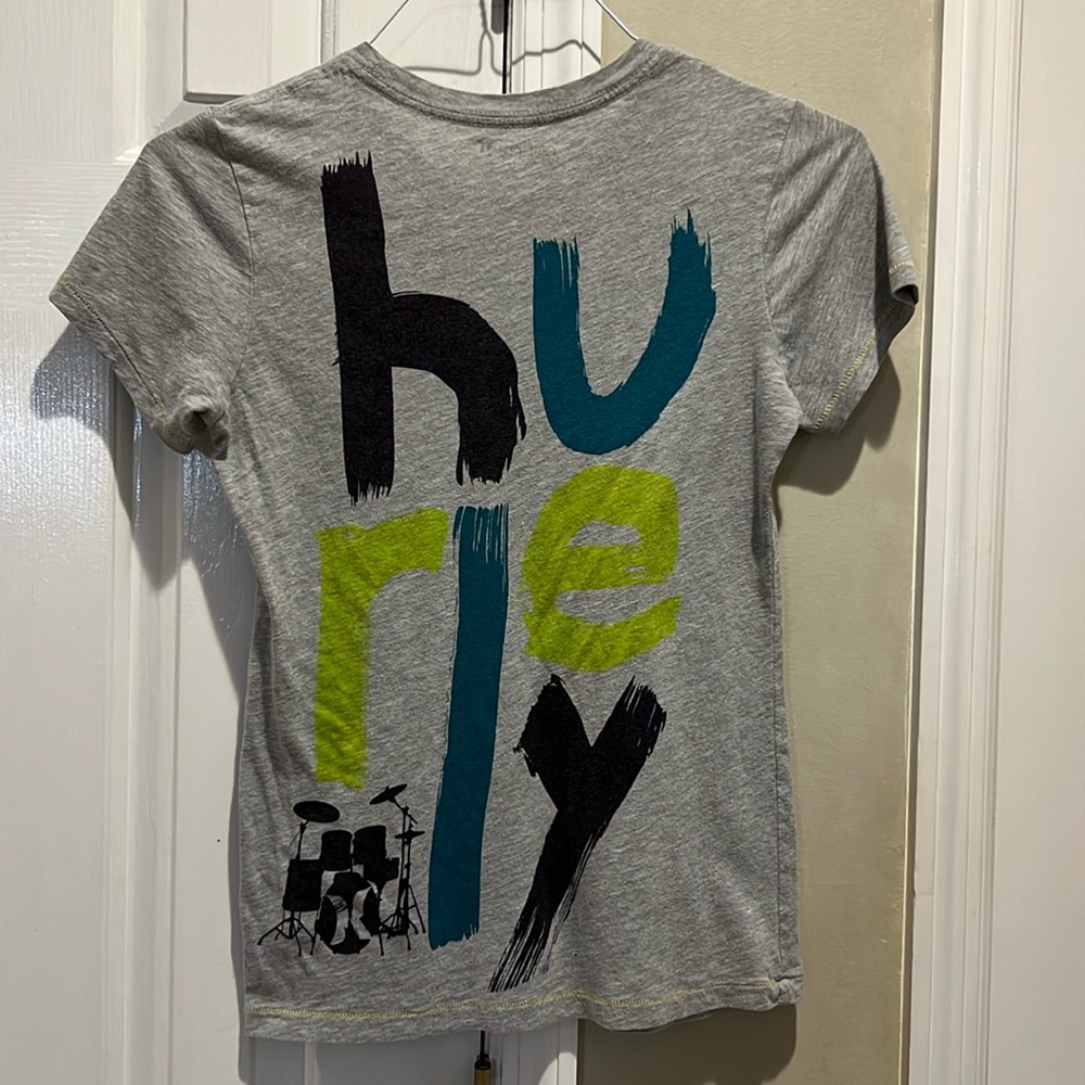 2/$10 This Hurley shirt is super cool with navy, teal, and yellow letters.